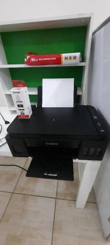 canon pixma 2411 printer with 1 black ink and A4 papers